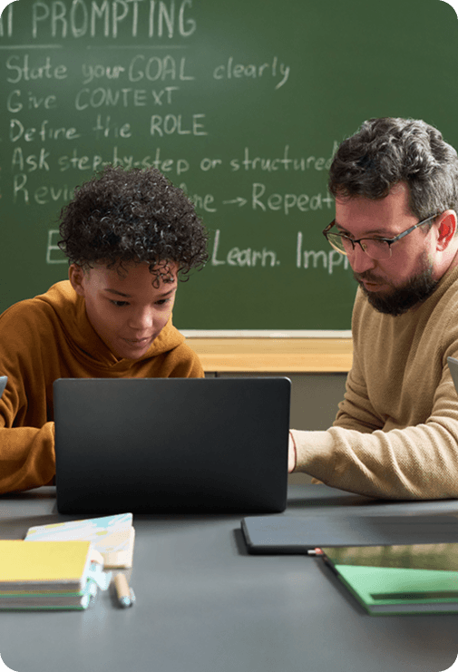 Student and parent learning together in front of laptop